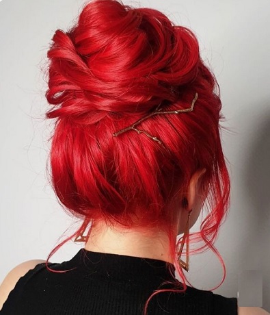 Red hair and chic hair bun